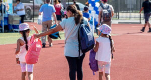 Back to school: Free supplies, drives, and backpack giveaways in Philly Yasaret Beltran (center) with six-year-old twin daughters, Lilliana (left) and Mia, walking away with new backpacks during Philly's back-to-school tour on Aug. 10 outside South Philadelphia High School.Read moreJOSE F. MORENO / Staff Photographer