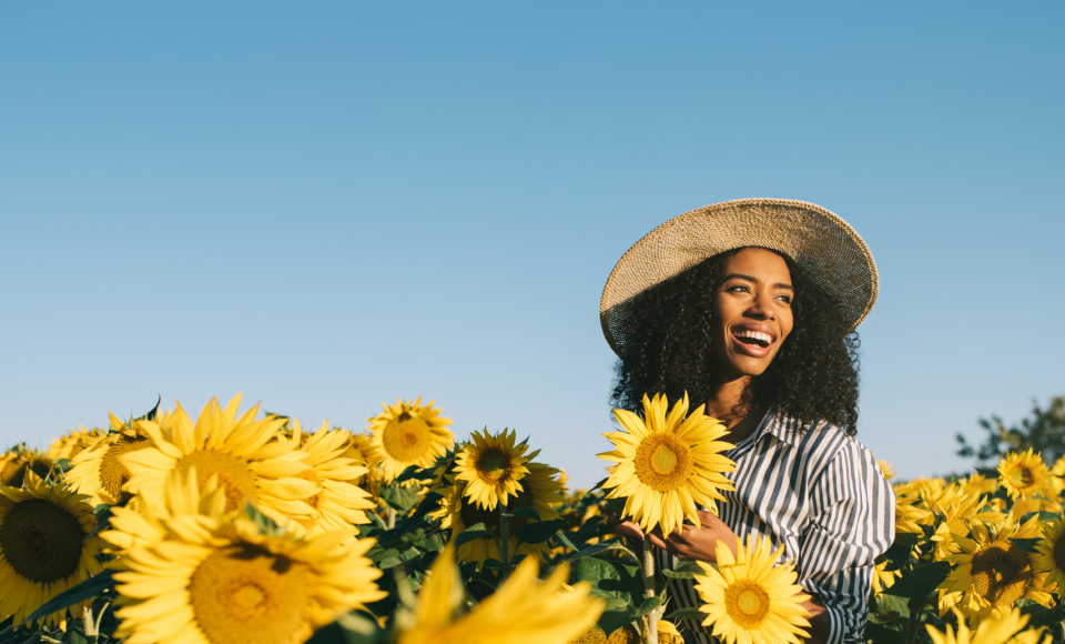 woman-flowers-sunrise-iStock-960x750